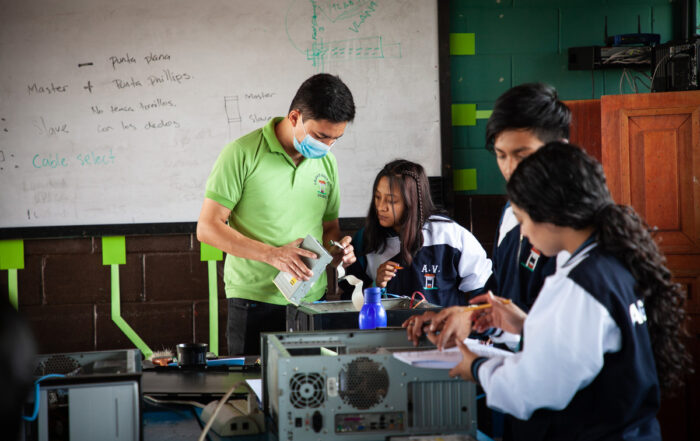 Alexis with his students in computer lab